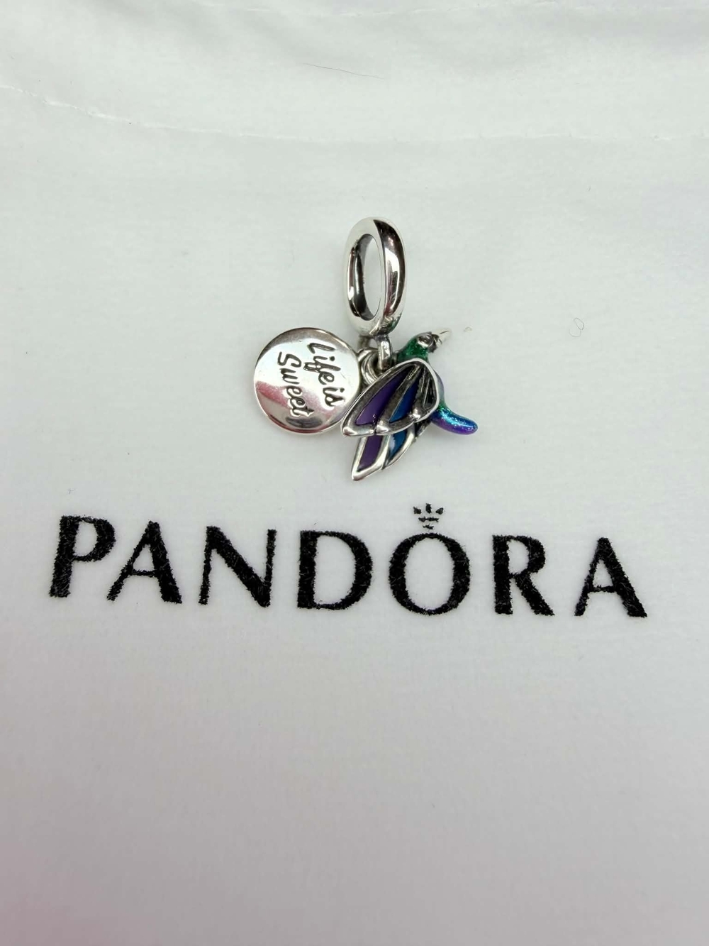 Pandora Charm on Branded Background